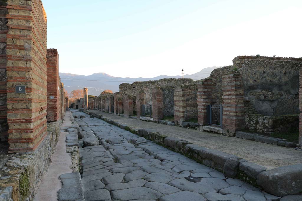 Via Stabiana, Pompeii. December 2018. 
Looking south between IX.4.8, on left, and VII.2.15, on right, on corner of Vicolo del Panettiere. Photo courtesy of Aude Durand.


