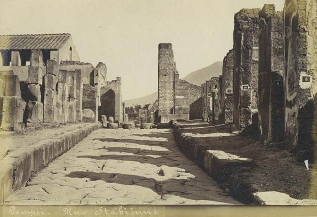Via Stabiana, Pompeii. Undated photograph by Mauri, numbered 018. Looking north towards Holconius’ crossroads, from between VIII.4 and I.4. Photo courtesy of Rick Bauer.
