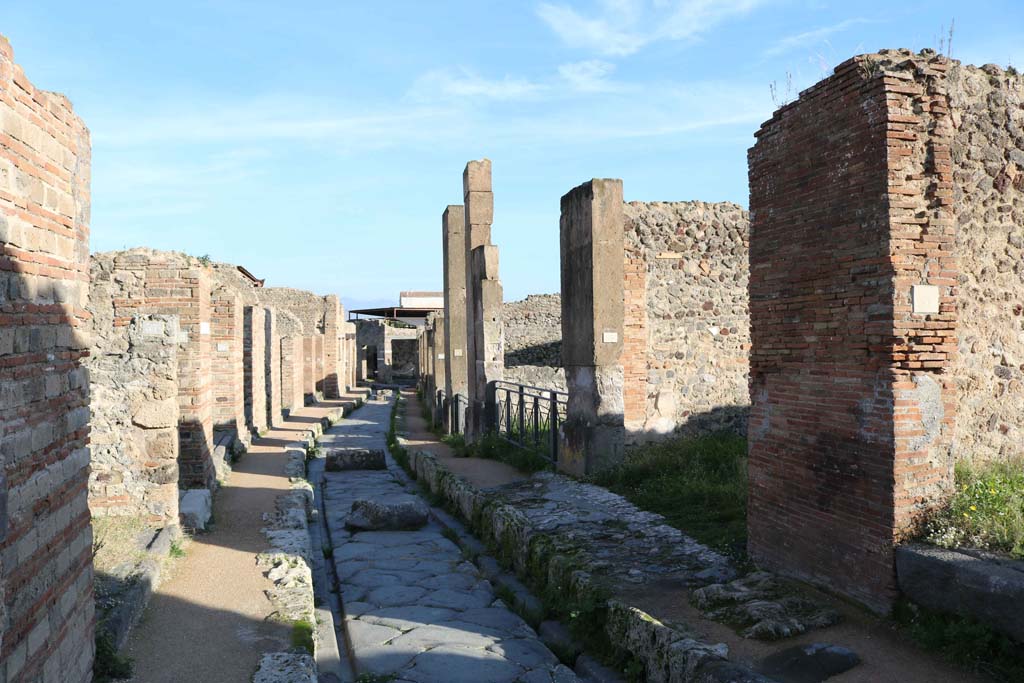 Via degli Augustali, Pompeii. December 2018. Looking east between VII.2, on left, and VII.12, on right. Photo courtesy of Aude Durand.