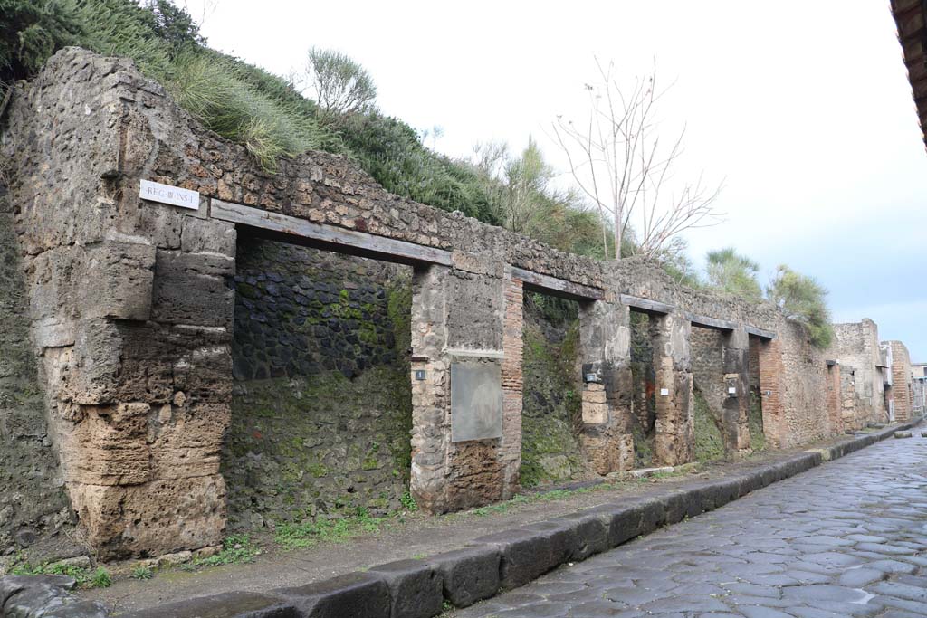 Via dell’Abbondanza, north side. Pompeii. December 2018. 
Looking west from III.1.5, on right, towards III.1.1, on left. Photo courtesy of Aude Durand.
