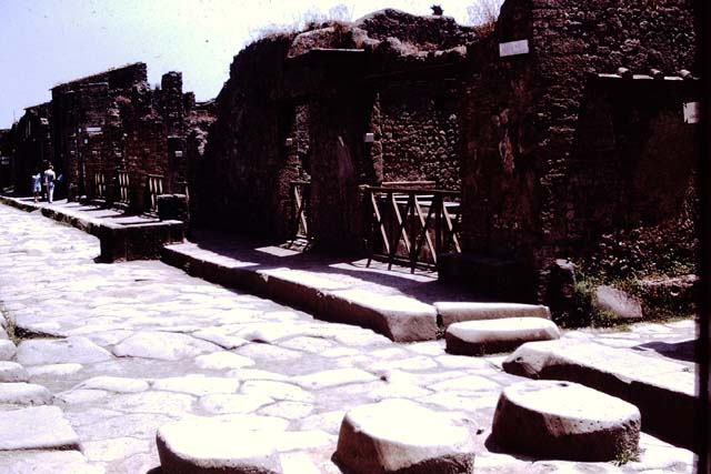Via dell’Abbondanza, south side. Pompeii. 1972. Looking east along II.1 from junction with Via di Nocera.  Photo by Stanley A. Jashemski. 
Source: The Wilhelmina and Stanley A. Jashemski archive in the University of Maryland Library, Special Collections (See collection page) and made available under the Creative Commons Attribution-Non Commercial License v.4. See Licence and use details. J72f0055
