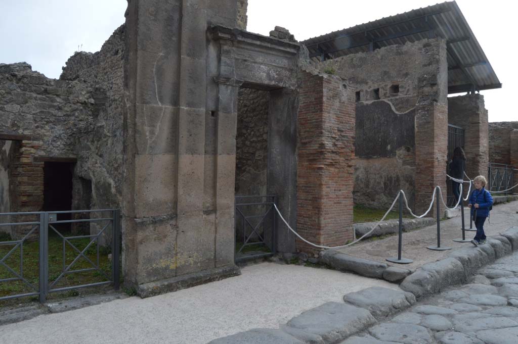 Via dell’Abbondanza, south side, Pompeii. December 2018. 
Looking south-west across fountain at VII.9.67/68, towards north side of Insula VIII.3. Photo courtesy of Aude Durand.
