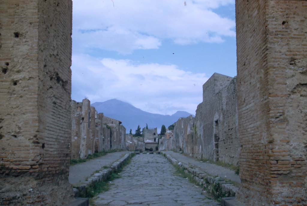 Via di Mercurio, Pompeii. November 1958. Looking north through Arch towards Tower XI, and Vesuvius. 
Photo courtesy of Rick Bauer.
