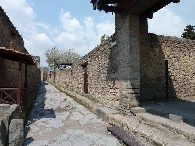 Via di Nocera, east side, Pompeii. December 2018. 
Looking north-east towards entrance doorways of II.1.10 and II.1.9, at junction with Via di Castricio, on right. Photo courtesy of Aude Durand.

