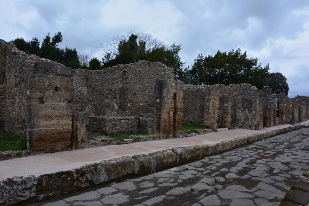 Via di Nola, north side, Pompeii. December 2018. Looking west towards V.2.1, from V.2.9, on right. Photo courtesy of Aude Durand.