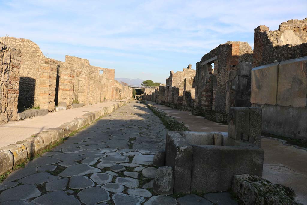 Via di Nola, Pompeii. April 2019. 
Looking east between V.3 and IX.8, from junction with Vicolo dei balconi, on left, and Vicolo del Centenario, on right.
Photo courtesy of Rick Bauer.

