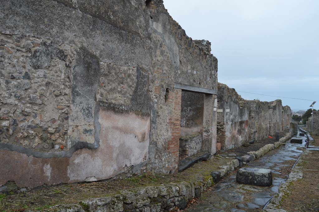 Vicolo dei Soprastanti, north side, Pompeii. October 2017. 
Looking north-west towards doorways of VII.6.35 and 34, followed by junction with Vicolo del Farmacista. 
Foto Taylor Lauritsen, ERC Grant 681269 DÉCOR.
