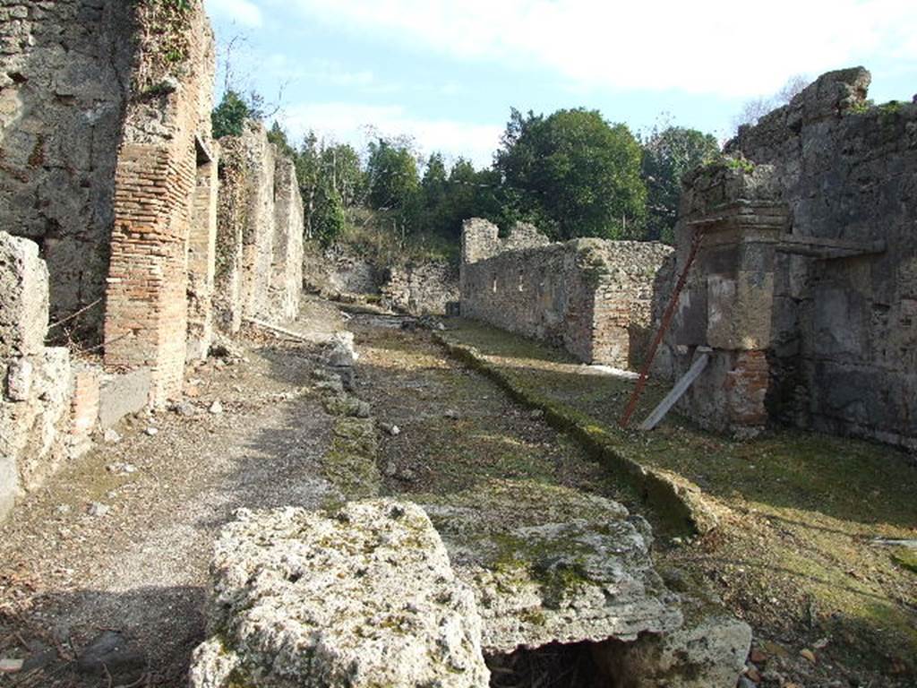 Vicolo del Conciapelle between I.2 and I.5.  Looking east.  December 2006.