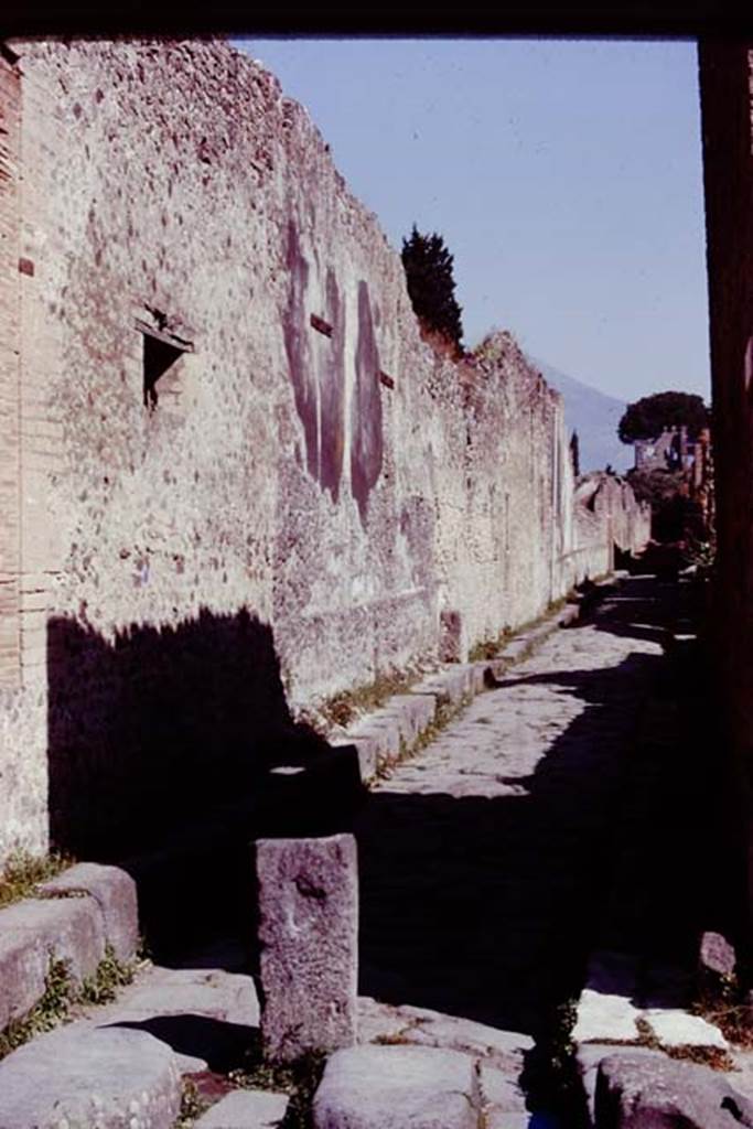 Vicolo del Labirinto, Pompeii. 1978. Looking north along west side, side wall of House of the Faun, VI.12. Photo by Stanley A. Jashemski.   
Source: The Wilhelmina and Stanley A. Jashemski archive in the University of Maryland Library, Special Collections (See collection page) and made available under the Creative Commons Attribution-Non Commercial License v.4. See Licence and use details. J78f0227
