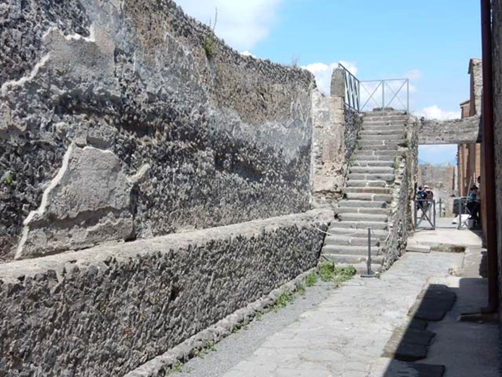 Vicolo di Championnet between VIII.2 and VIII.1. May 2018. Looking east towards the Forum and stone steps to upper gallery. Photo courtesy of Buzz Ferebee.

