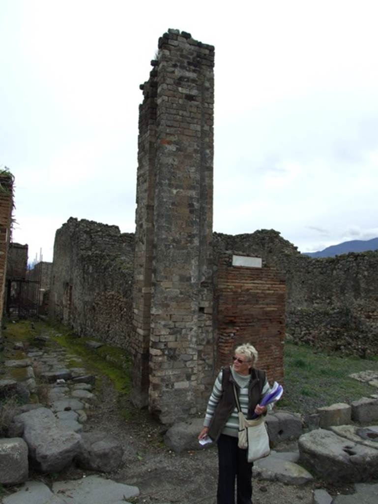 Vicolo di Eumachia (on right). March 2009.
Junction looking east along Vicolo del Balcone Pensile on left with water tower on right. 
