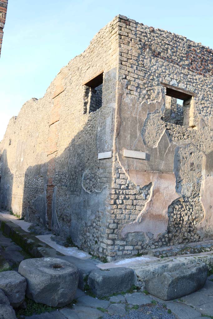 Vicolo di Tesmo, on left, Pompeii. December 2018.
Looking north-east to front façade of IX.5.19 on unnamed roadway between IX.5 and IX.6, on right. 
Photo courtesy of Aude Durand.

