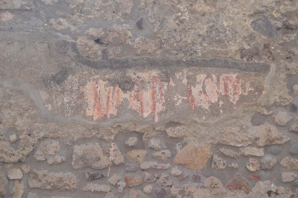 Vicolo di Tesmo, Pompeii. March 2019. Remaining graffiti on wall above seat outside IX.3.20. 
Foto Taylor Lauritsen, ERC Grant 681269 DÉCOR.
