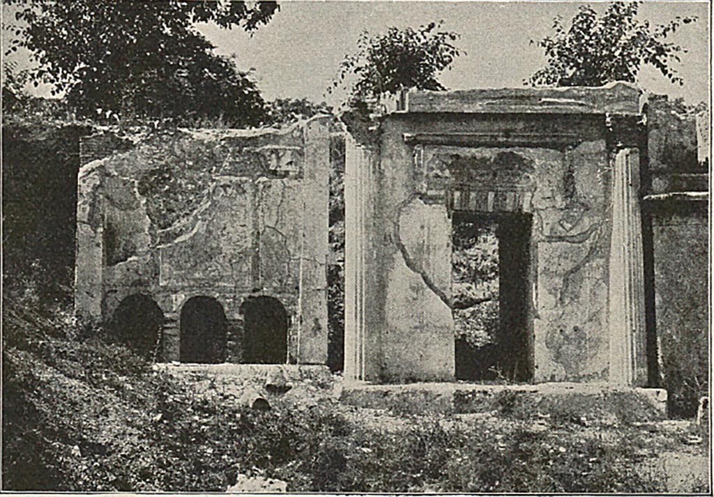 Pompeii FP3. Detail from late 19th century photo. The tomb has a vaulted sepulchral chamber entered from the rear. On the inside of the wall next to the street were three niches. Each niche contained an urn. Directly over the inner niches, and opening to the street, are three other niches (seen in this photo). Each had a libation tube allowing relatives to pour oil and wine on to the urns inside. Lava bust stones, one with the appearance of a woman, were placed at the back of the three outer niches. See Mau, A., 1907, translated by Kelsey F. W. Pompeii: Its Life and Art. New York: Macmillan. (p. 434-5).