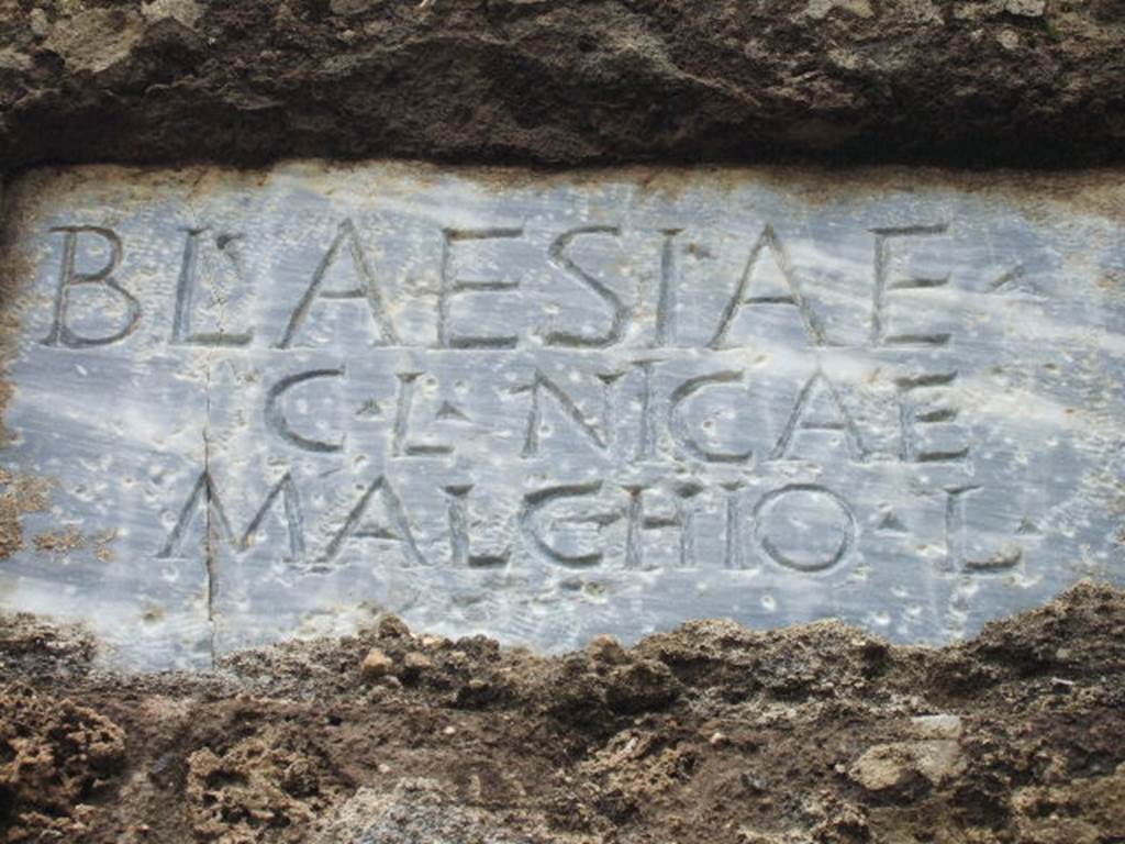FPNH Pompeii. August 2011. Plaque in centre of south side with inscription to BLAESIAE C. L. NICAE MALCHIO L. Photo courtesy of Peter Gurney.