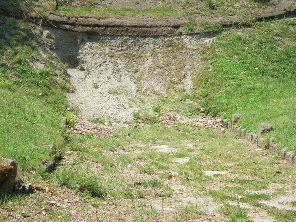 NGOF Pompeii. May 2006. Looking west from roadway leading into unexcavated lapilli showing surge layers and debris of 79AD.
