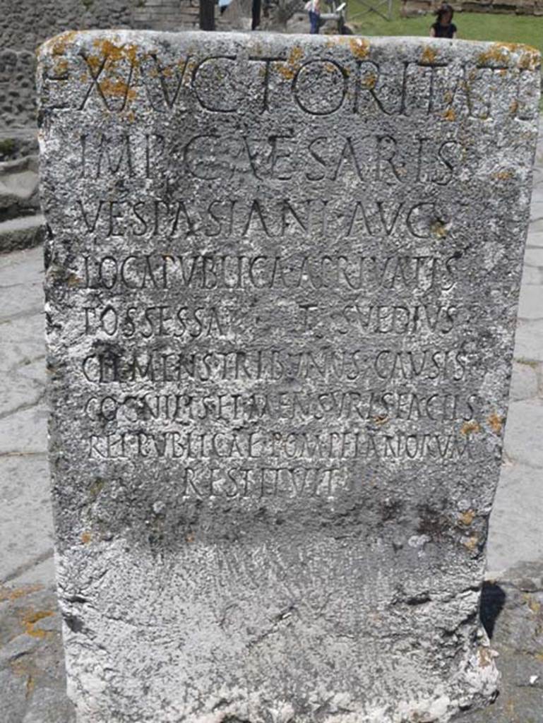 Pompeii Porta Nocera. May 2012. South side of Cippus of Titus Suedius Clemens.
Photo courtesy of Buzz Ferebee. The Cippus has the Latin inscription:

Ex auctoritate 
imp(eratoris) Caesaris 
Vespasiani Aug(usti)
loca publica, a privatis
possessa T(itus) Suedius 
Clemens tribunus causis 
cognitis et mensuris factis 
rei publicae Pompeianorum 
restituit,  

By virtue of authority conferred upon him by the Emperor Vespasian Caesar Augustus, 
Titus Suedius Clemens, tribune, having investigated the facts and taken measurements,
restored to the citizens of Pompeii public places illegally appropriated by private persons.

Similar Cippi were found at the Porta Ercolano, Porta Marina and the Porta Vesuvio.
The wording “rei publicae Pompeianorum” on one of these, discovered in 1763, was the first positive identification that the site was Pompeii. 
Until then scholars had divided opinions on the city buried under Cività.  
Many, including the first official excavators, thought it was the ancient city of Stabiae.
See Conticello, B., Ed, 1990. Rediscovering Pompeii. Rome: L’Erma di Bretschneider. (p. 225).

