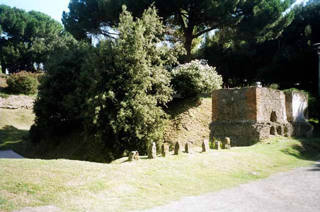 Pompeii Porta Nocera. July 2010. Tombs 34EN, 36EN and 38EN. Looking east on Via delle Tombe. Photo courtesy of Rick Bauer.
