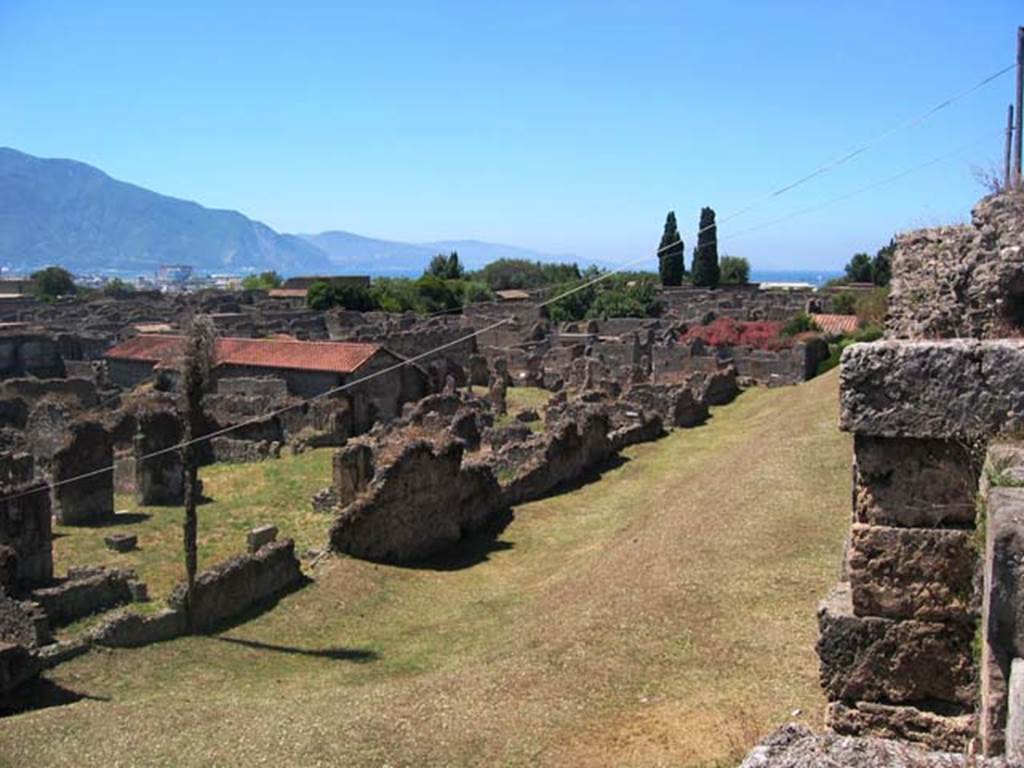 Tower X, Pompeii, on right. July 2008. Looking south-west  across north end of VI.11 towards Sorrentine Peninsula. VI.11.19/20 is seen on the left. Photo courtesy of Barry Hobson.

