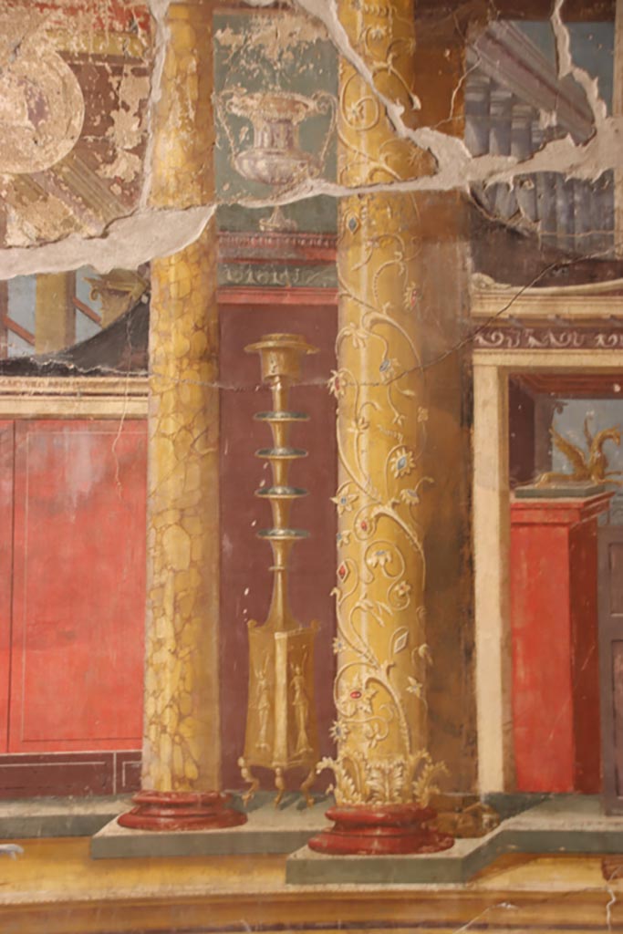 Villa of Poppaea, Oplontis, October 2023.
Room 14, detail of painted decoration on left of central panel of west wall of triclinium. 
Photo courtesy of Klaus Heese.
