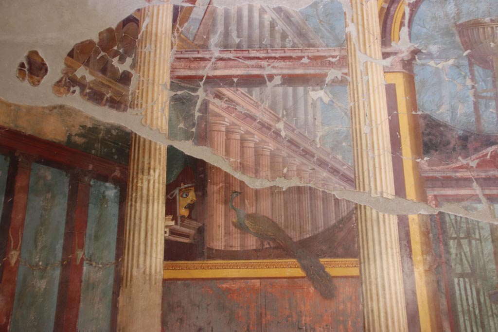 Oplontis Villa of Poppea, September 2021. 
Room 15, detail of tragic mask and peacock, from north end of east wall. Photo courtesy of Klaus Heese.
