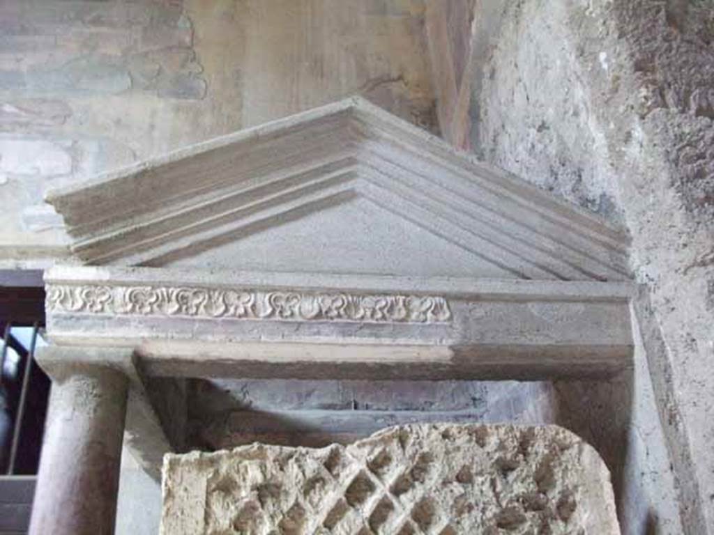 I.10.4 Pompeii. May 2010. North-west corner of atrium, side of the aedicula lararium, looking west.